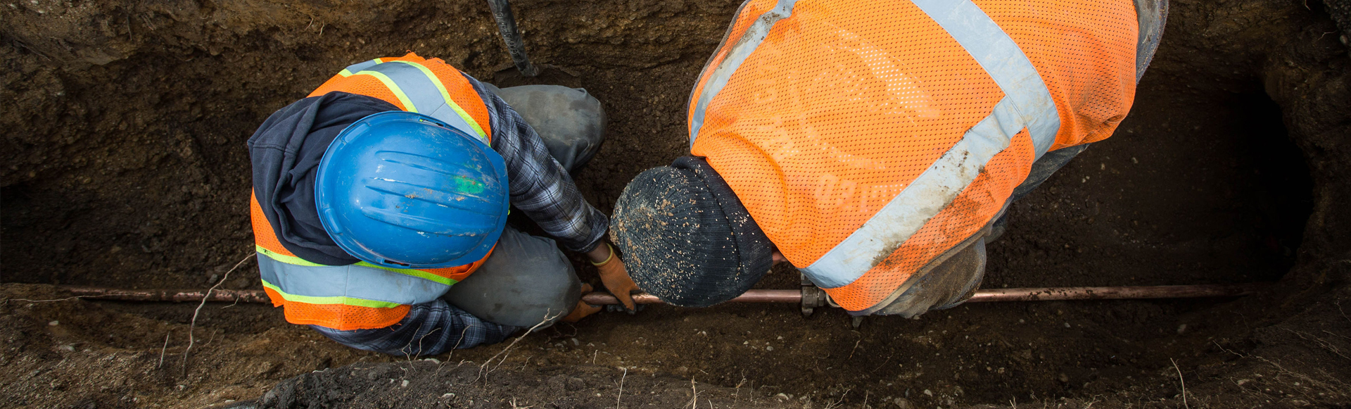 plumbers in trench header